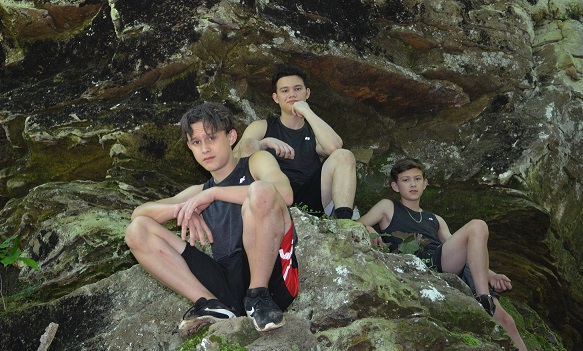 boys at the waterfall