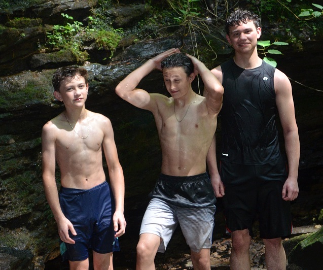 boys at the waterfall